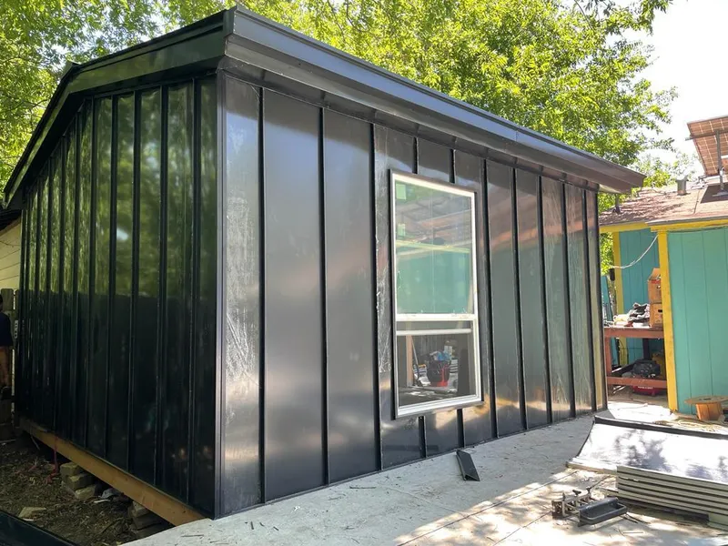 Black standing seam metal wall panels for Metal Roof Installation in North Bend