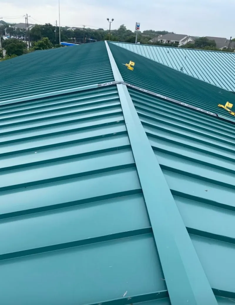 Green commercial metal roof ridge and valley for Metal Roof Repair in North Bend
